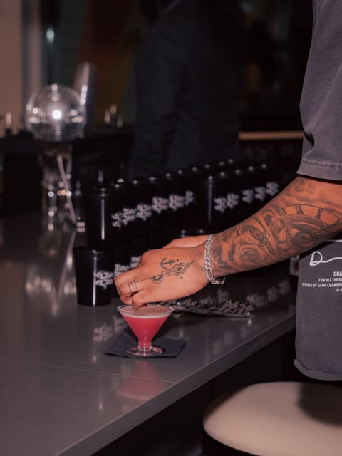 Bartender crafting a cocktail at the bar